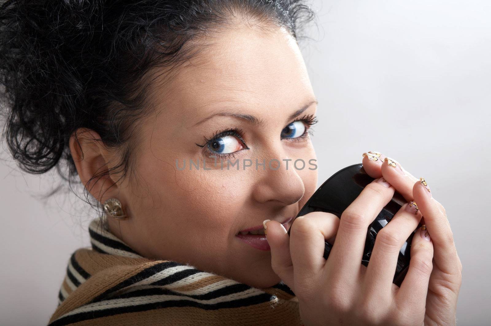 An image of beautiful girl drinking hot tea