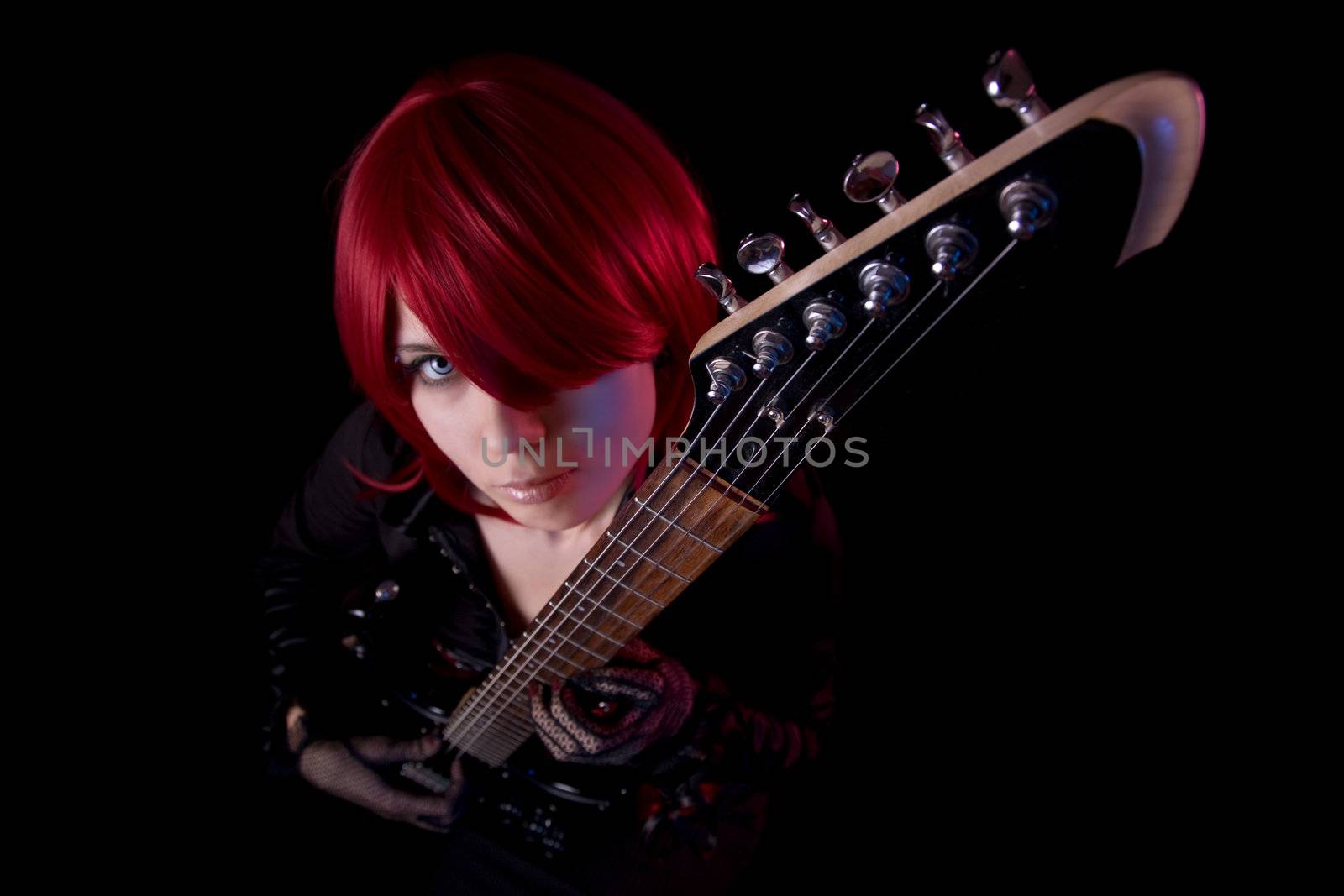 Sensual girl with guitar, selective focus on guitar, high angle view 