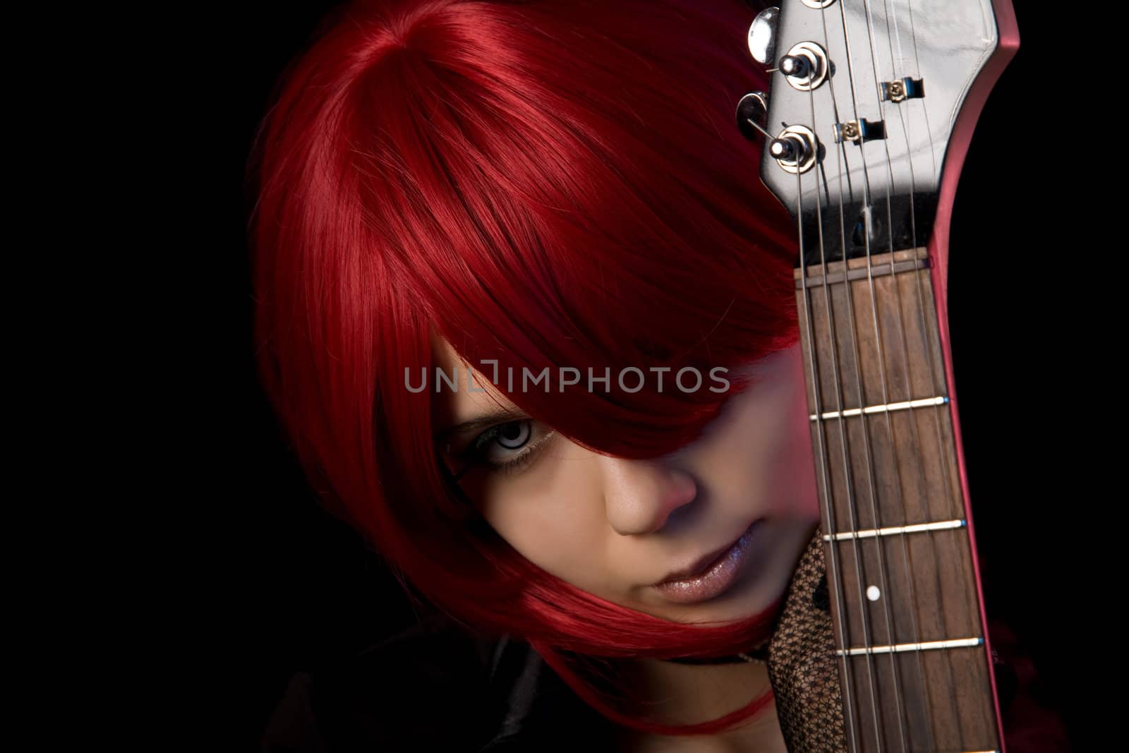 Vampire girl with guitar, focus on face 