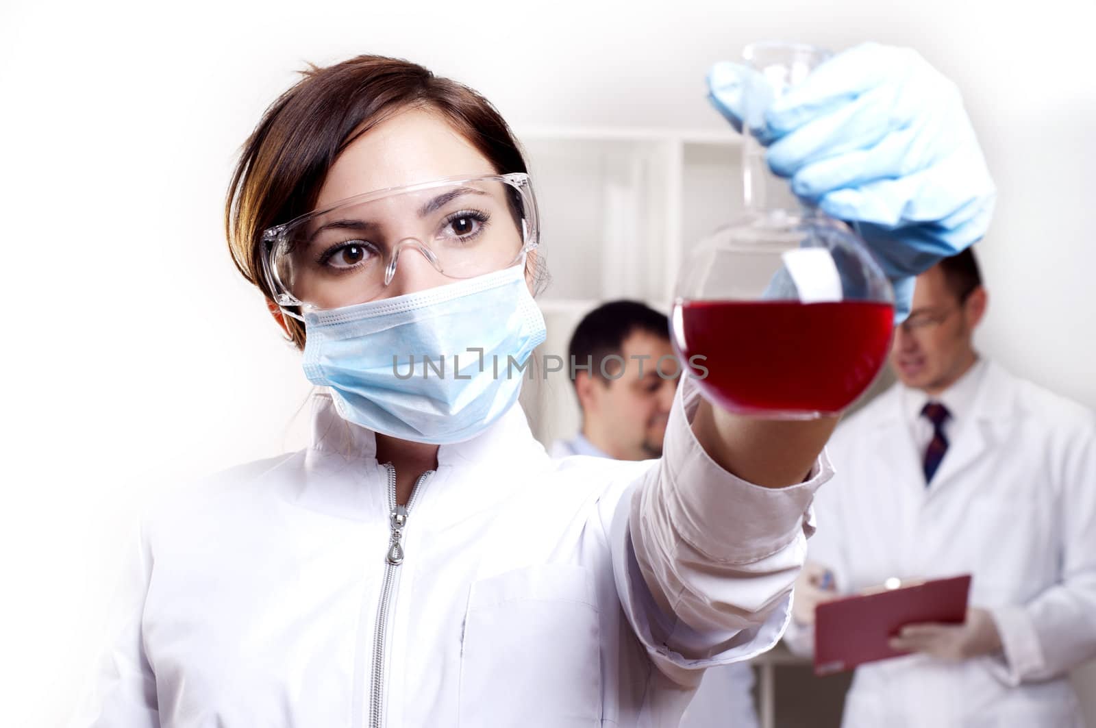 chemist working in the laboratory, mix liquid