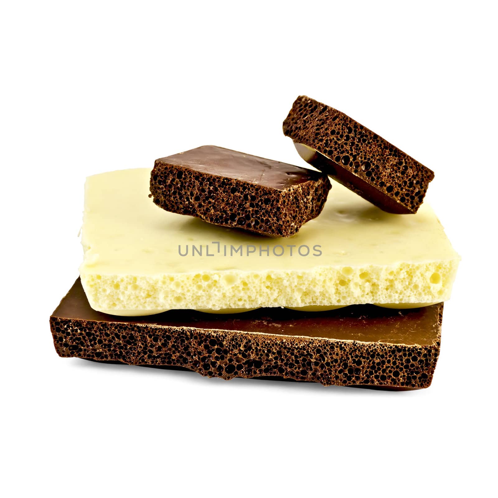 Chunks of white and dark chocolate porous isolated on white background