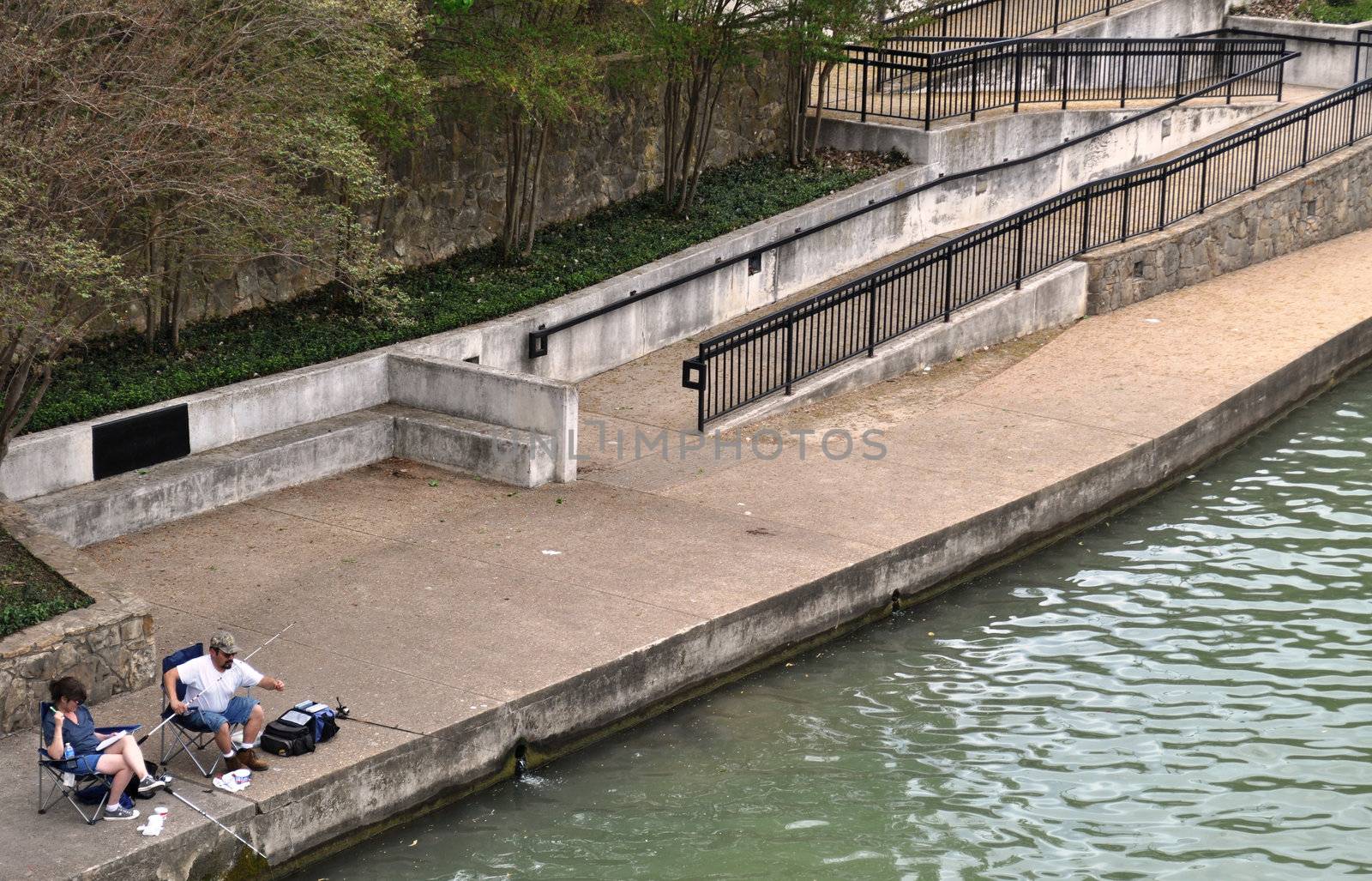 Waco couple fishes on the bank background