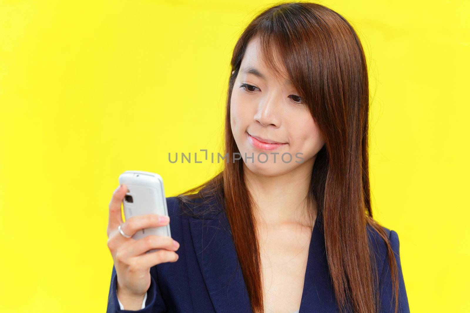 asian woman using mobile phone by leungchopan