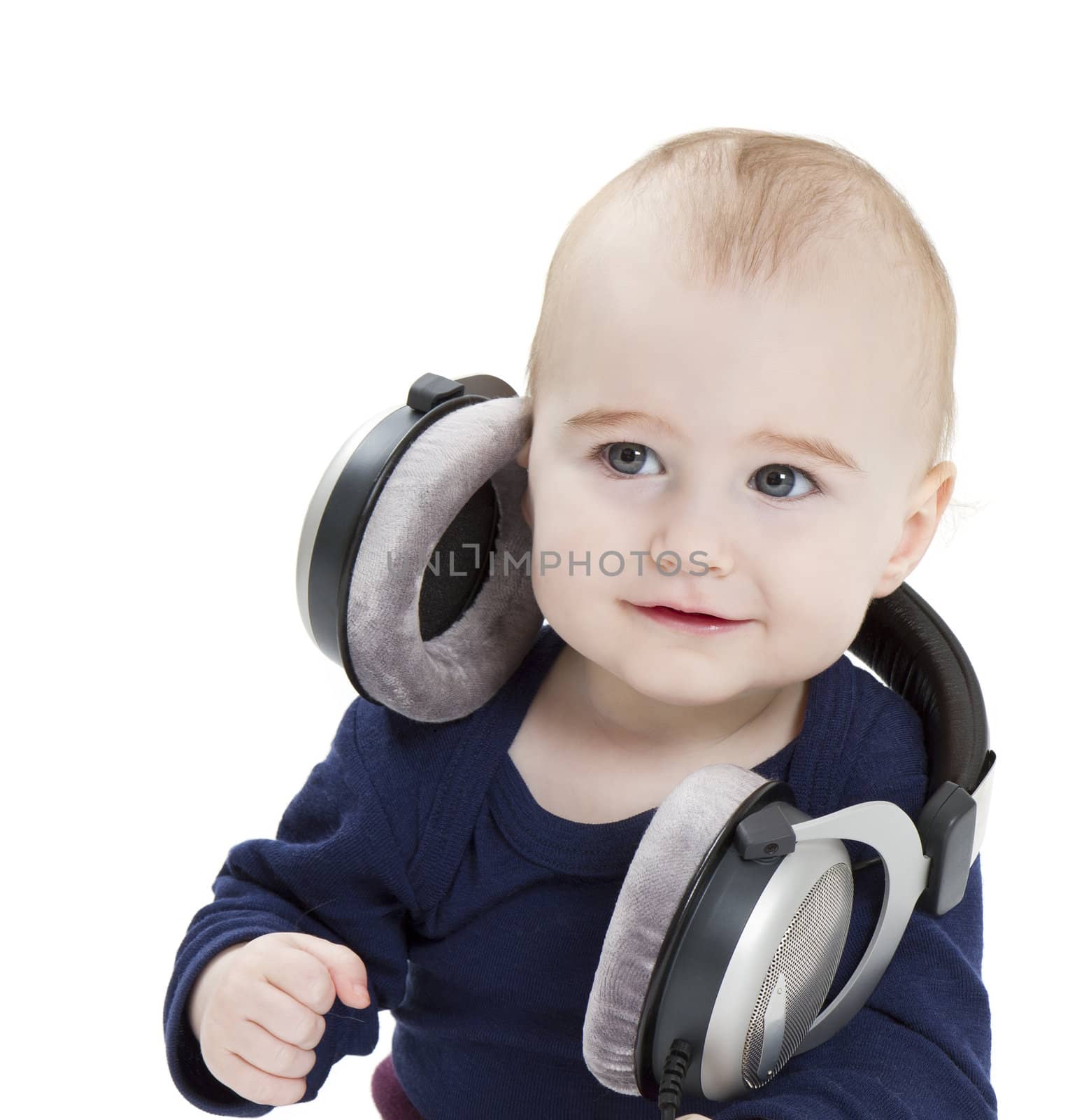 young child with ear-phones listening to music by gewoldi