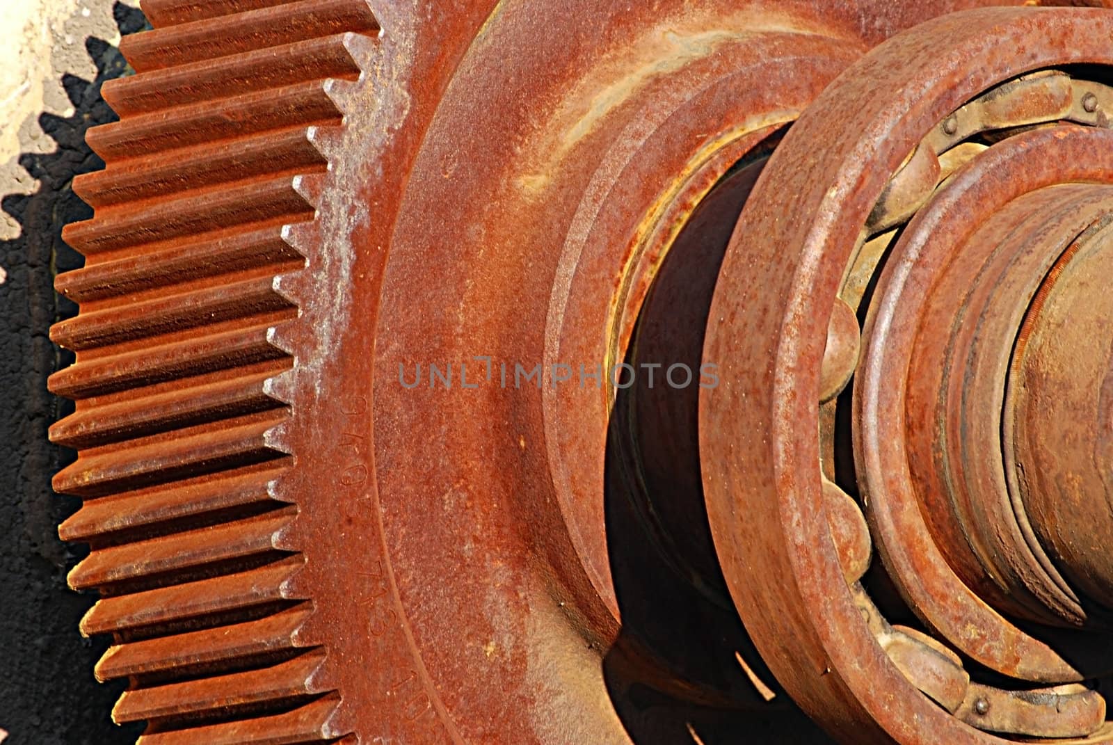 Rusty iron gear and roll-bearing detail close-up