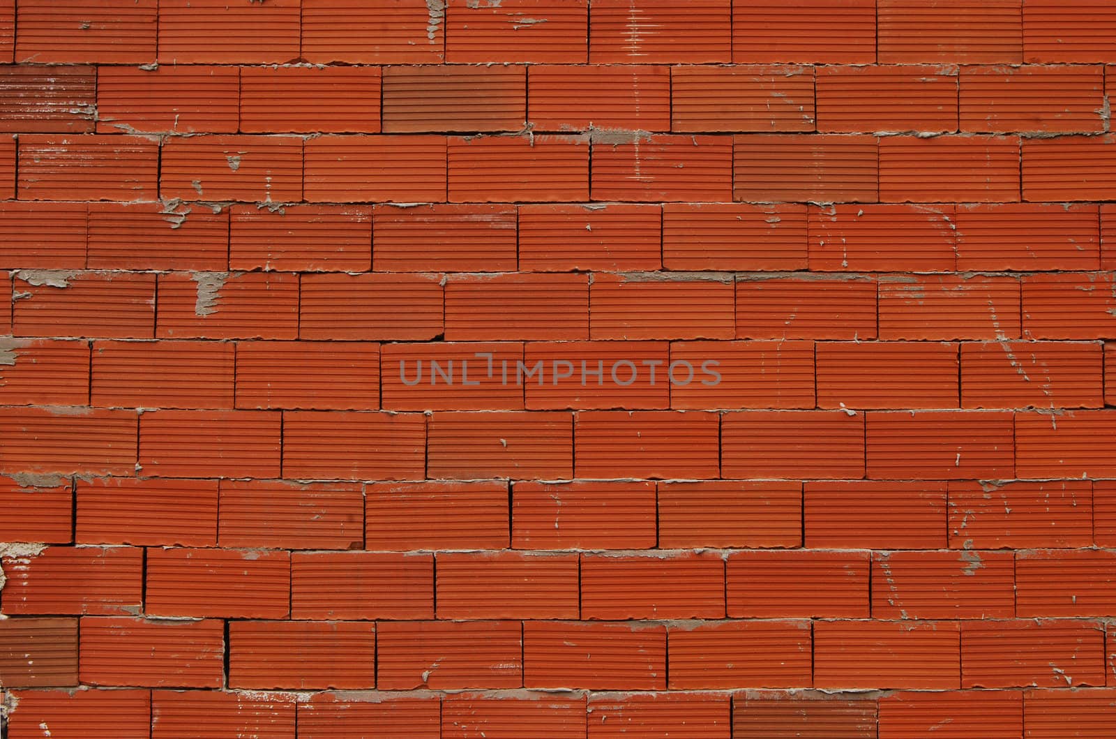 Red new bricks non-plastered wall as background