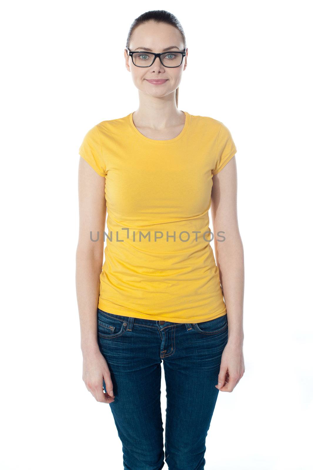 Smiling young woman in glasses posing over white background