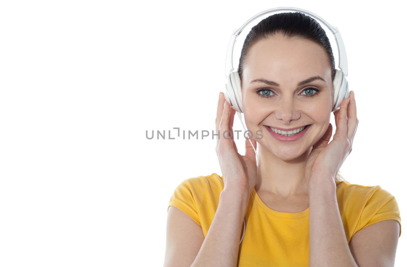 Attractive teenager listening to music on her mp3 player