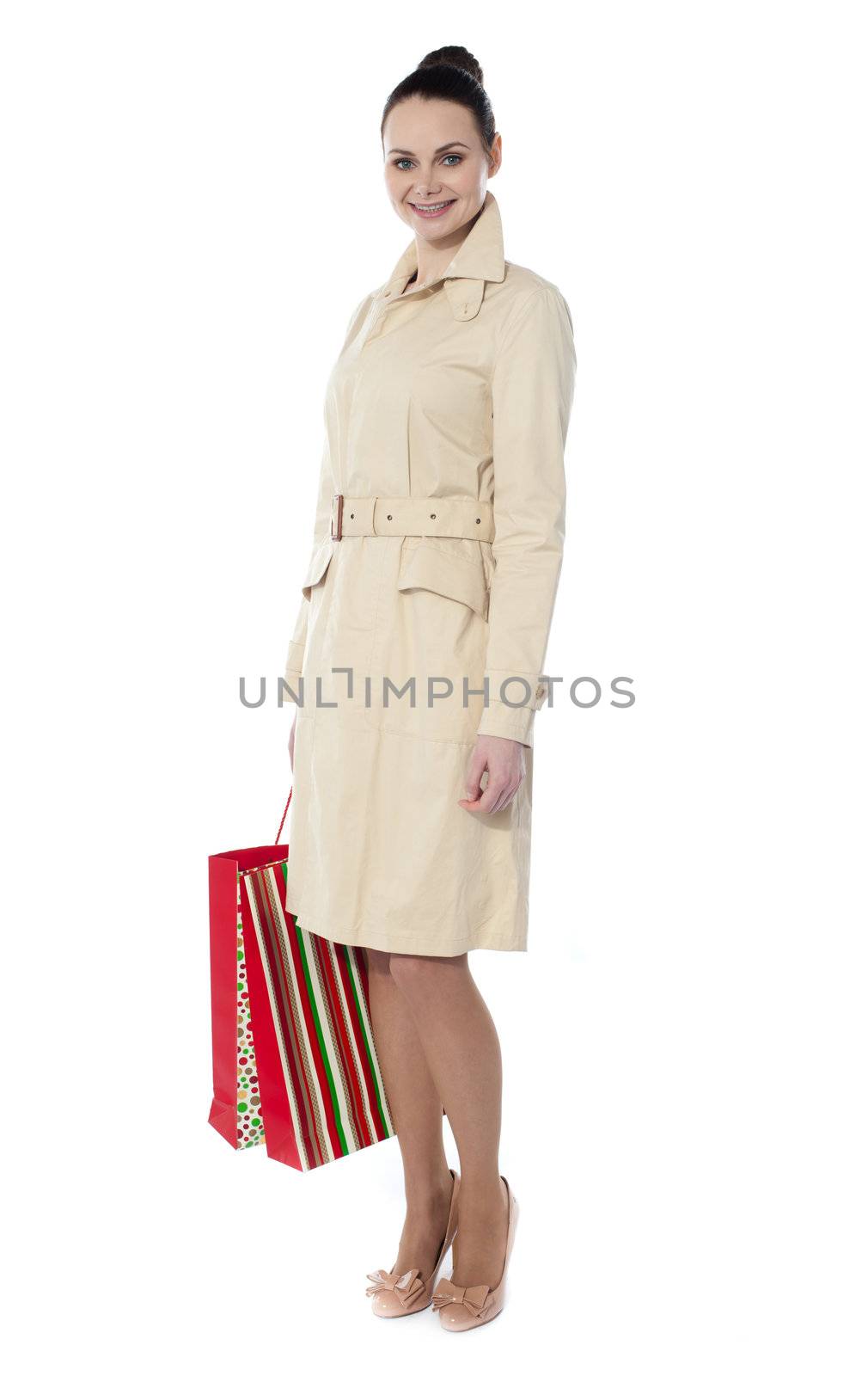 Lovely woman with shopping bags by stockyimages