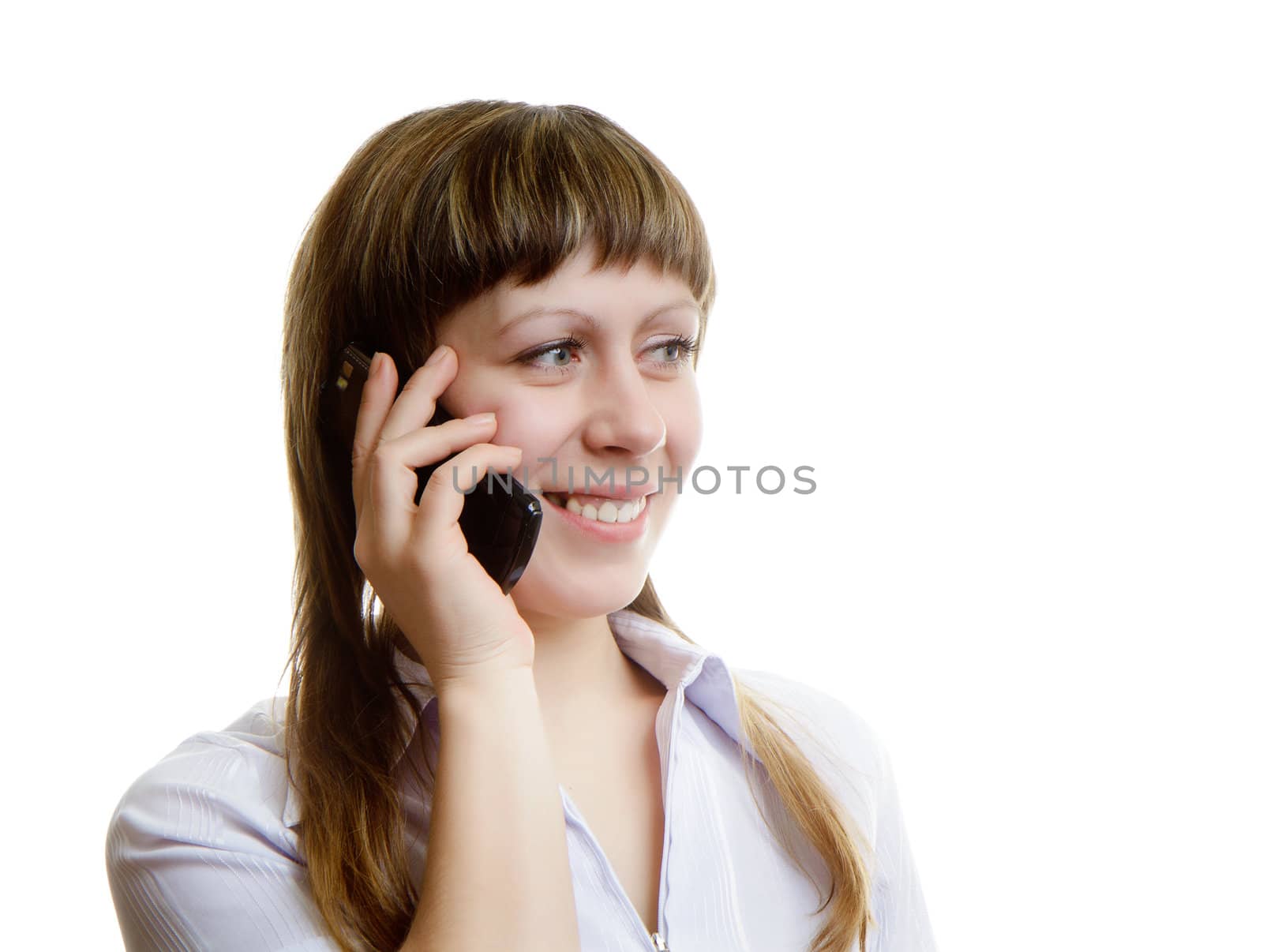 young woman talking on a cell phone on a white background