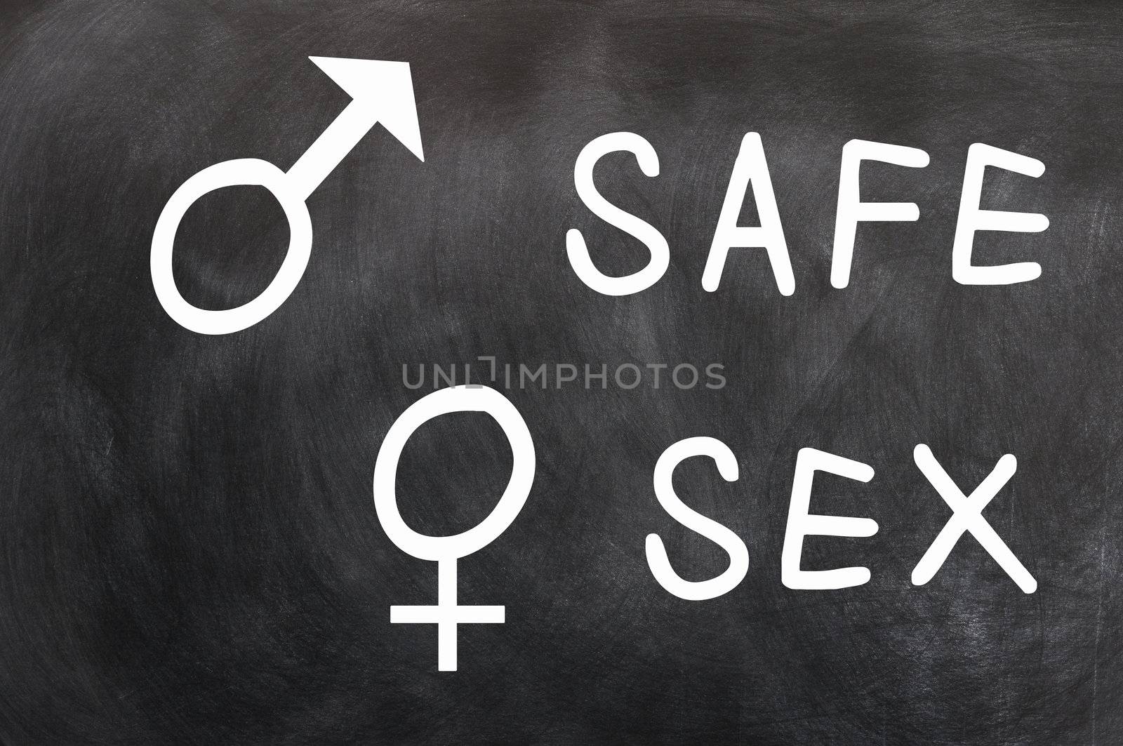 Safe Sex with gender symbols written with chalk on a blackboard