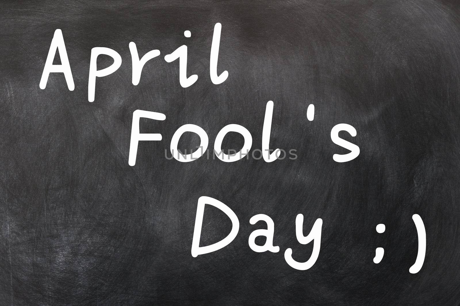 April Fool's Day written with white chalk on a blackboard