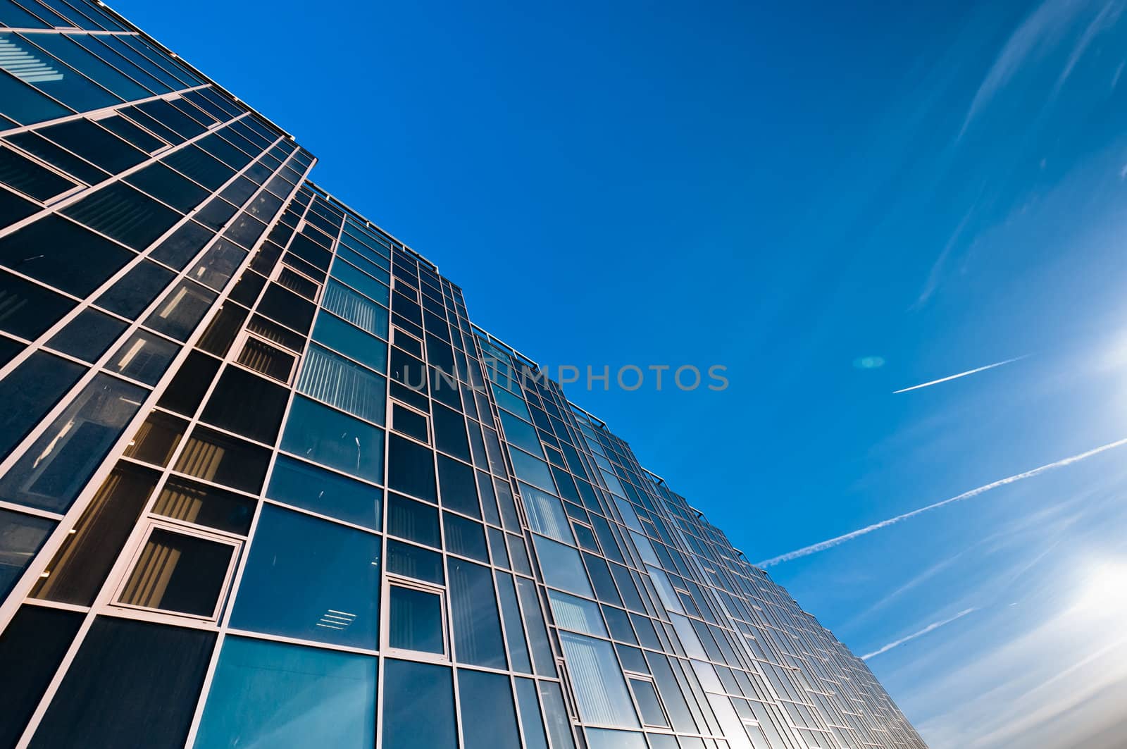 Glass wall of office building by dmitryelagin