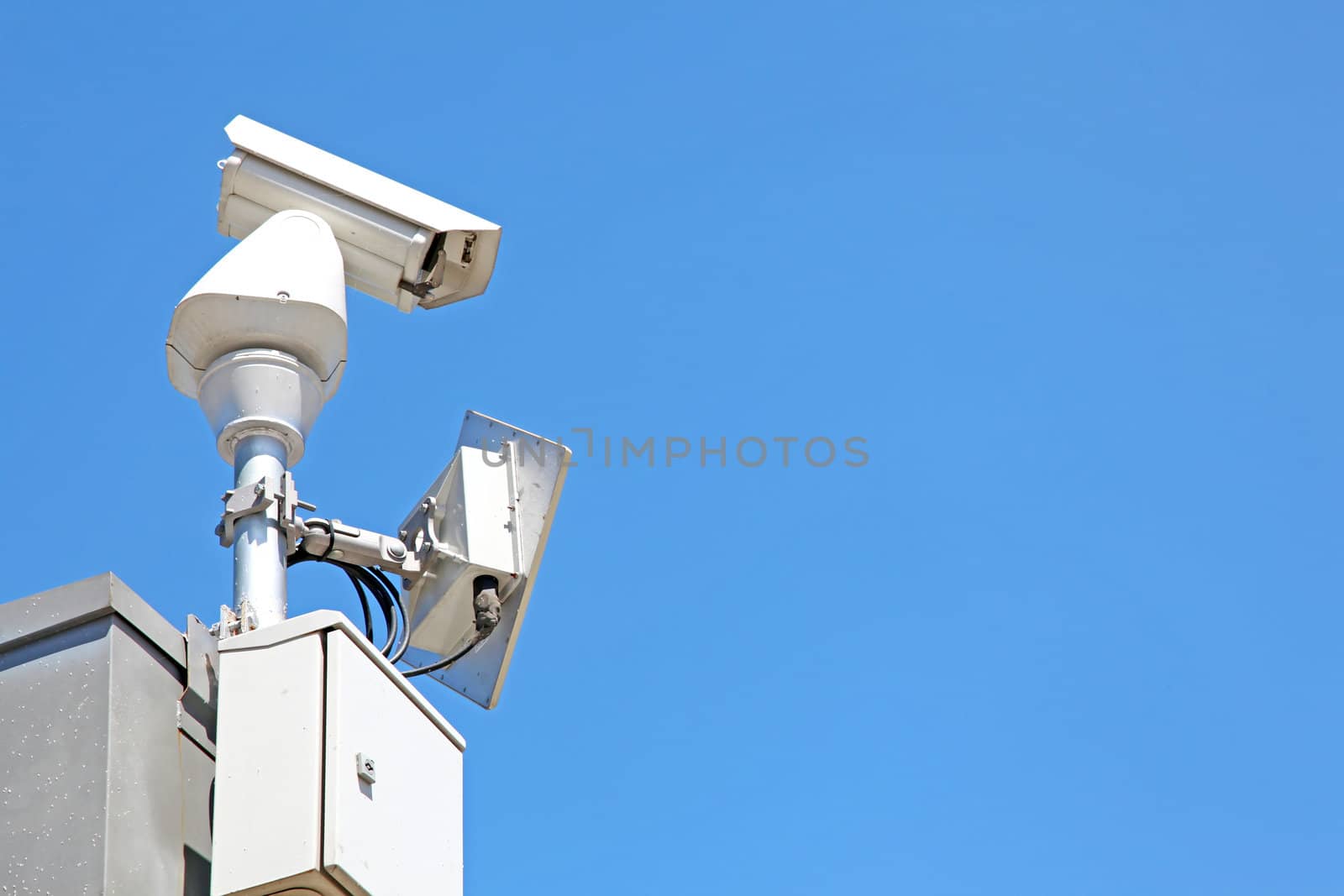 isolated Surveillance Security Camera or CCTV on blue sky