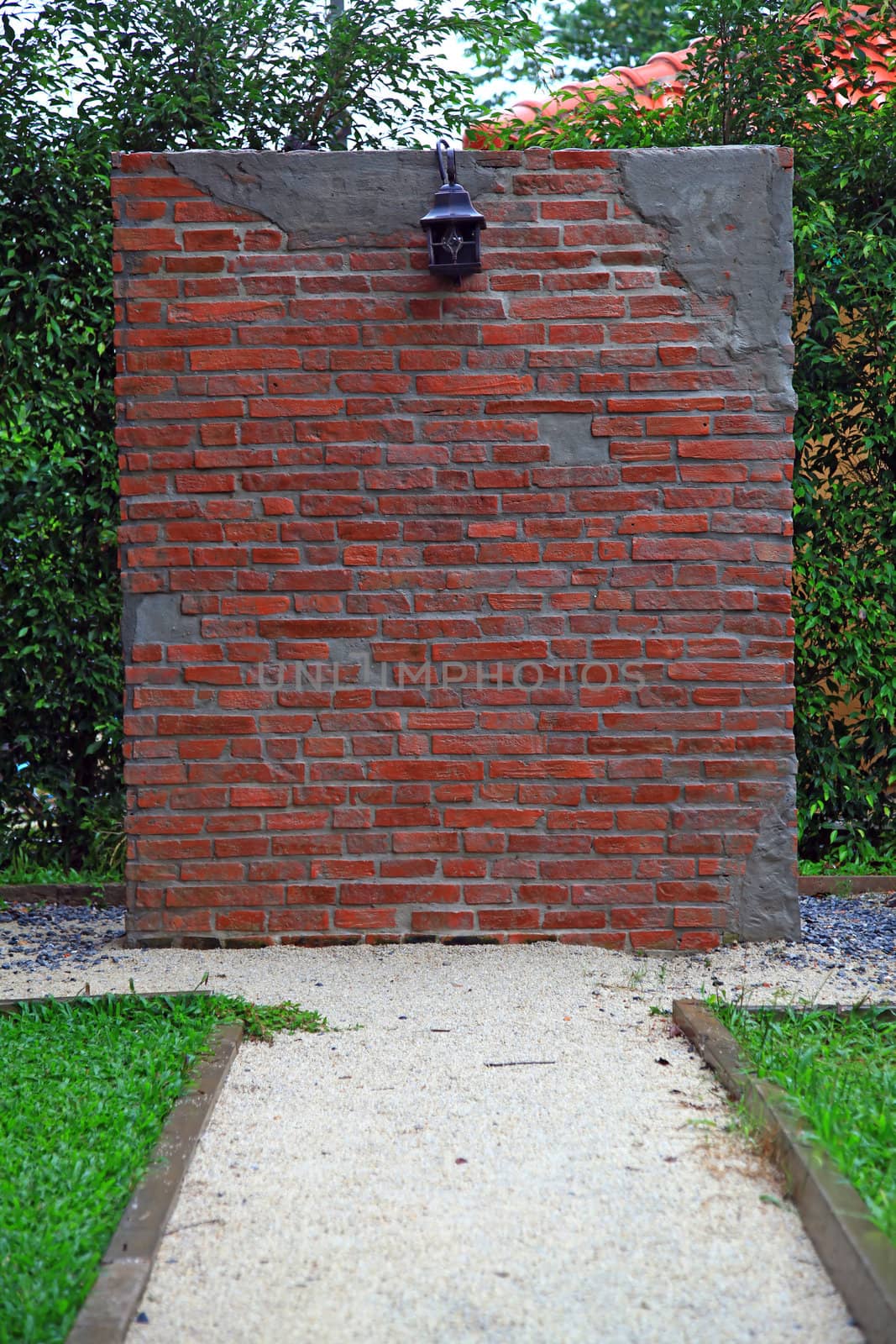 lamp on Under construction of Red brick wall with pavement