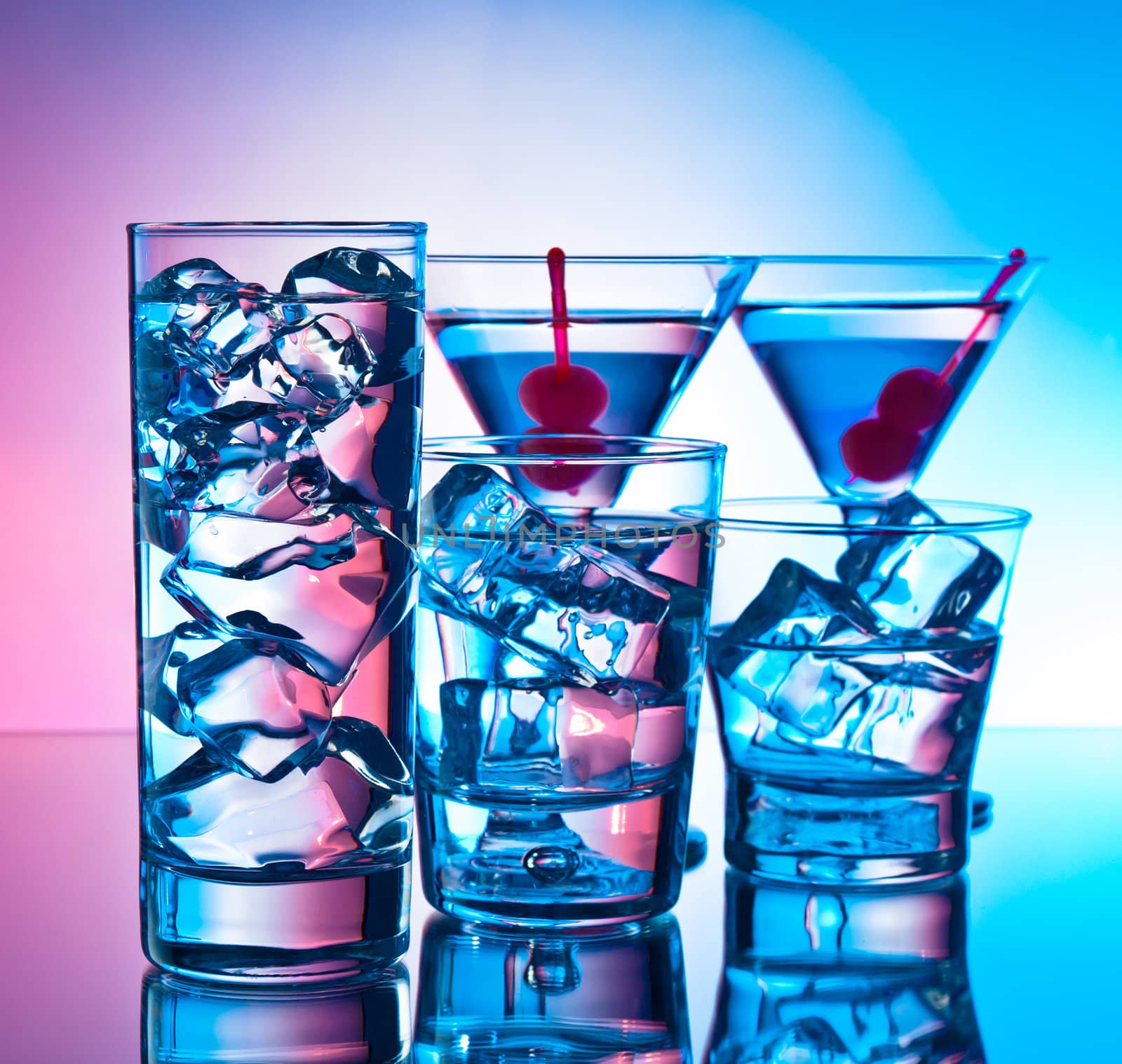 Variety of cocktails on pink and blue background