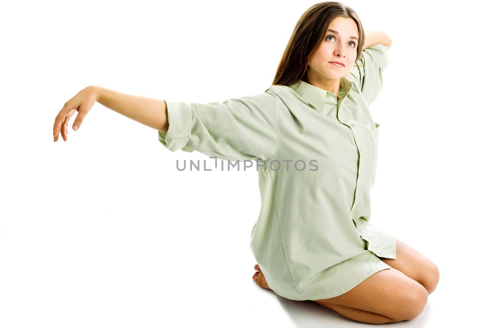 An image of a girl sitting on the floor