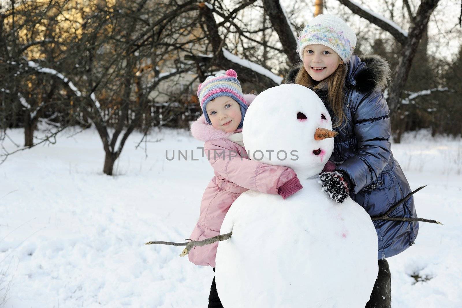 Sisters with snowman by velkol