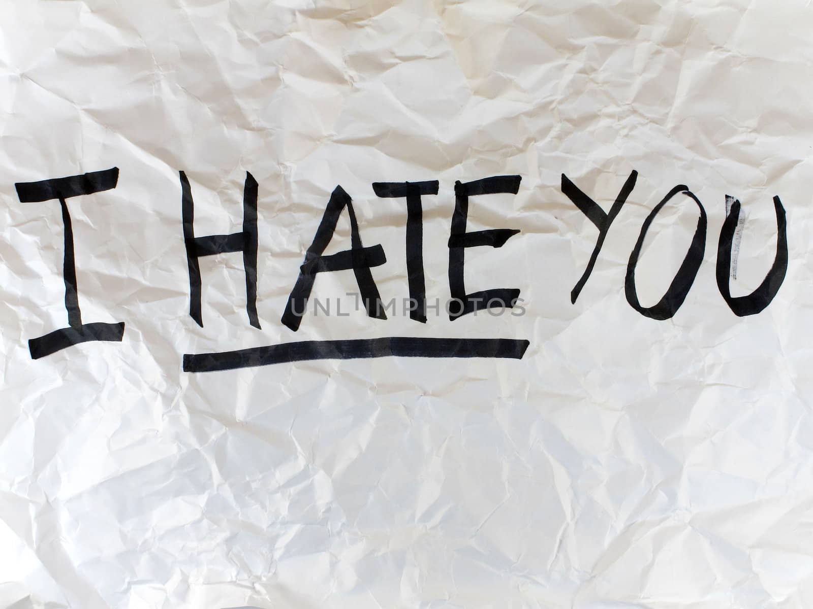 Write I HATE YOU on crumple white paper