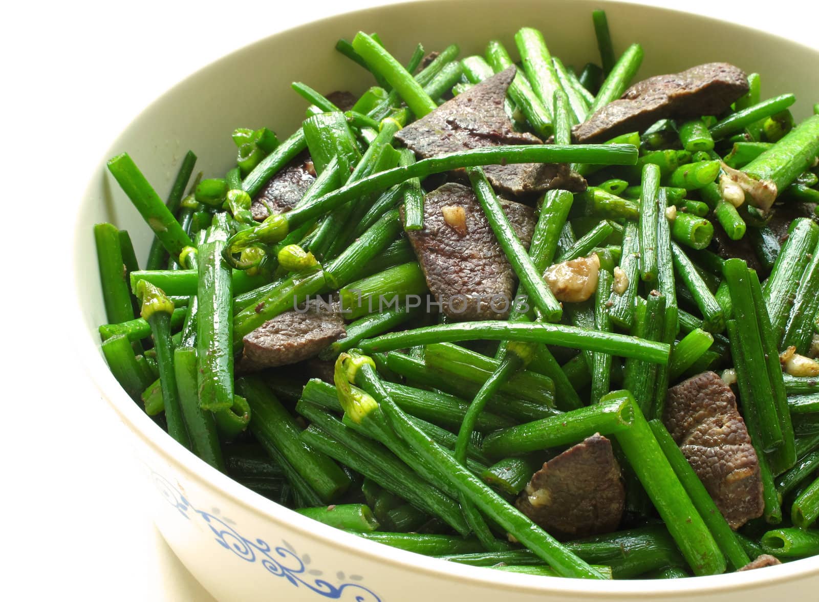 Pork Liver Stir Fried With Flowering Garlic Chives on white background