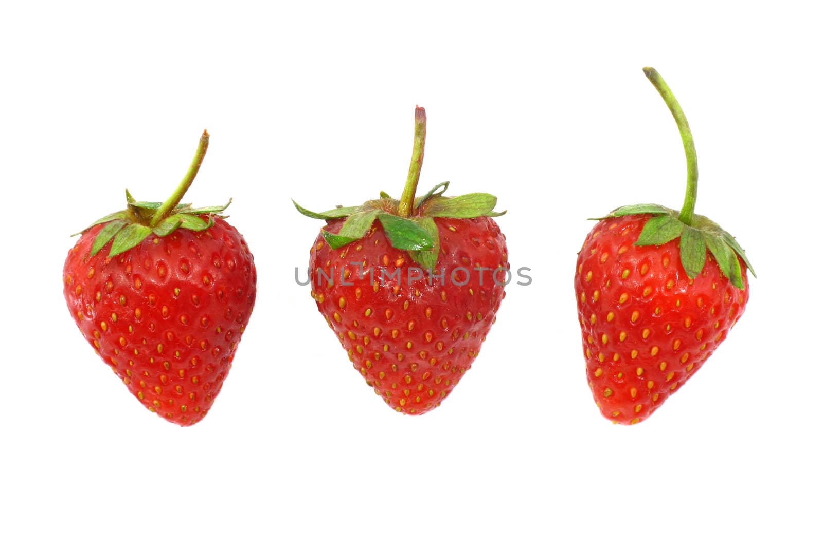 Three strawberries on white background