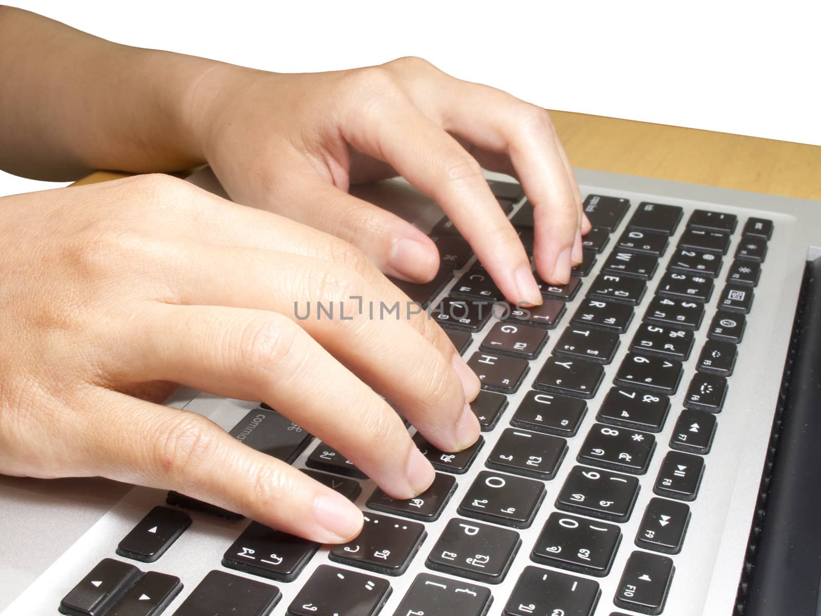 Human hand typing on keyboard on white background