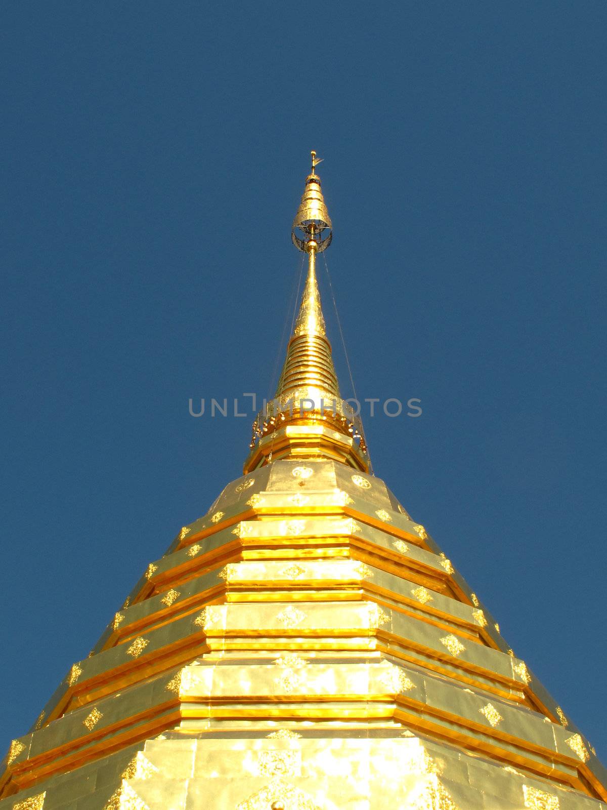 Golden pagoda with blue sky at Doi Suthep