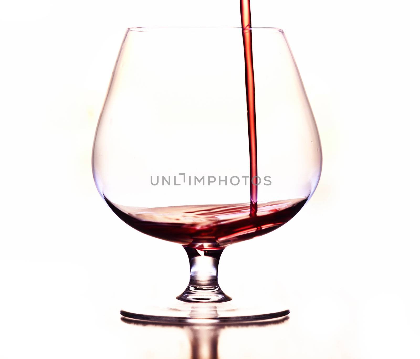 Detail of the wine glass - pouring wine