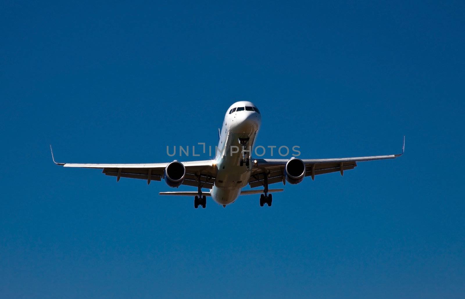 photograph of an airplane few seconds before landing 