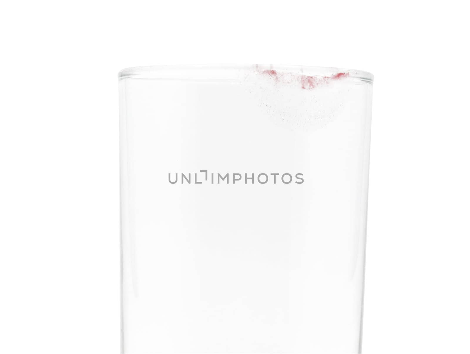 Glass with pink lipstick mark isolated with clipping path