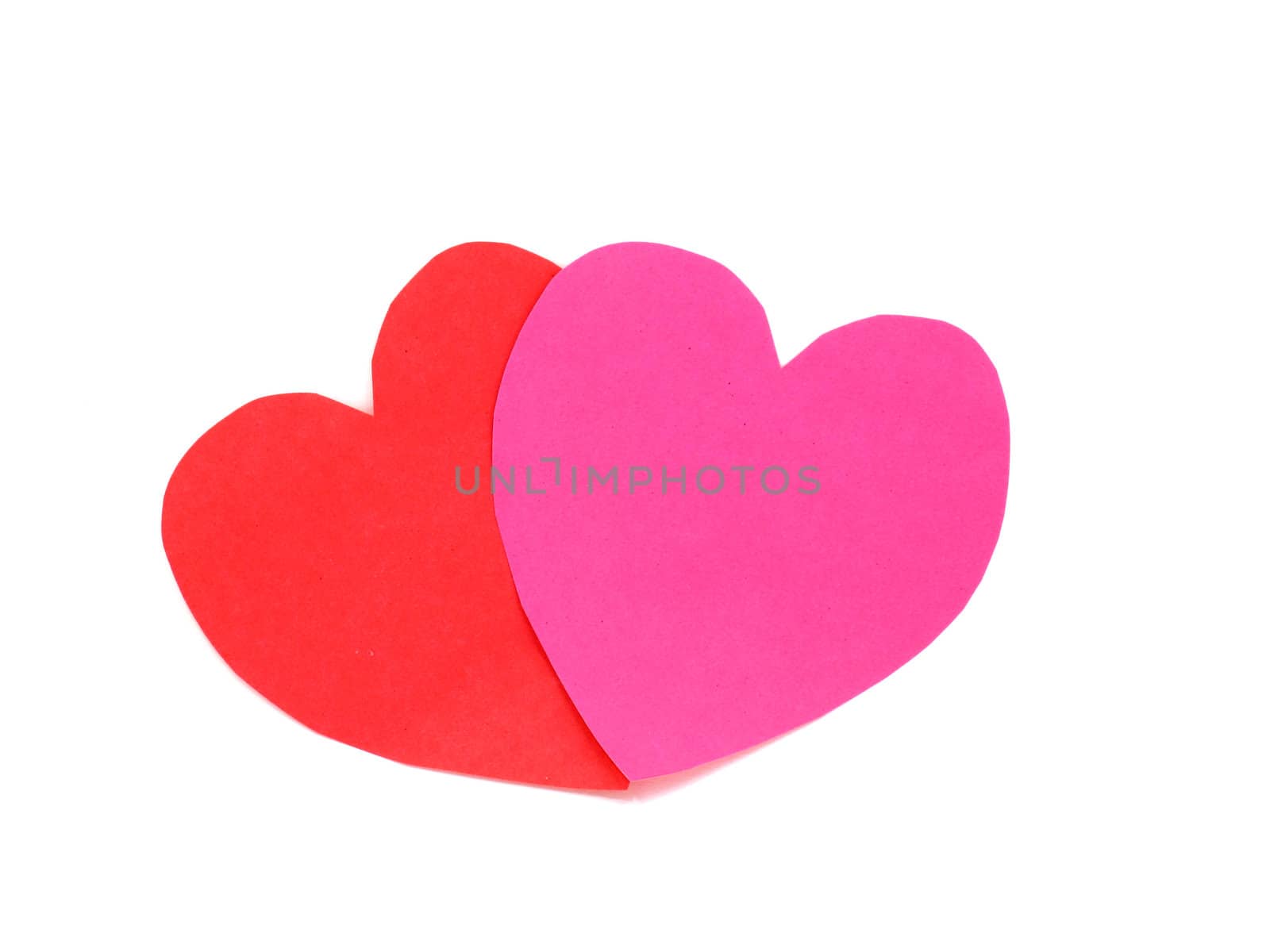 Red and pink hearts together on white background
