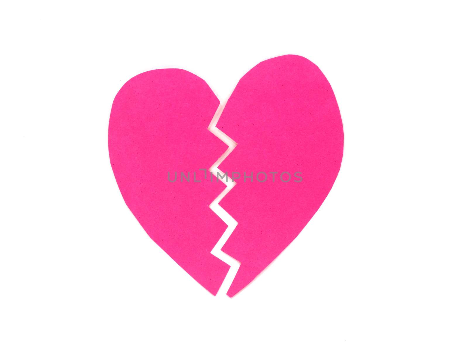 Broken pink heart on white background