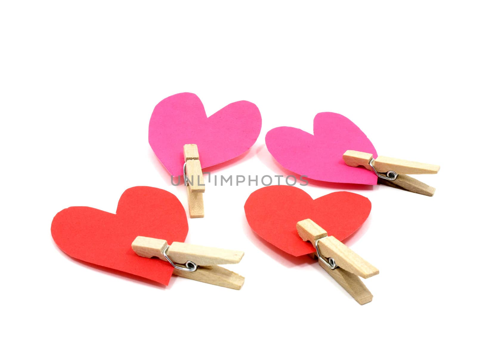 Four hearts with wooden pins by iampuay