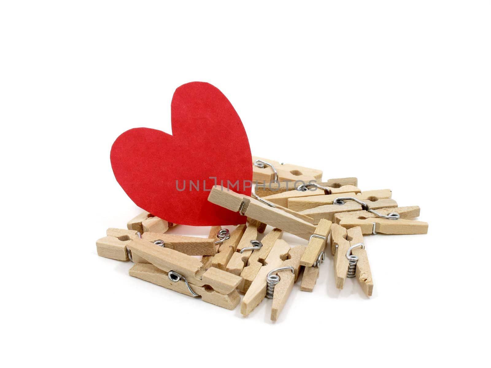 Red heart on many wooden pins by iampuay