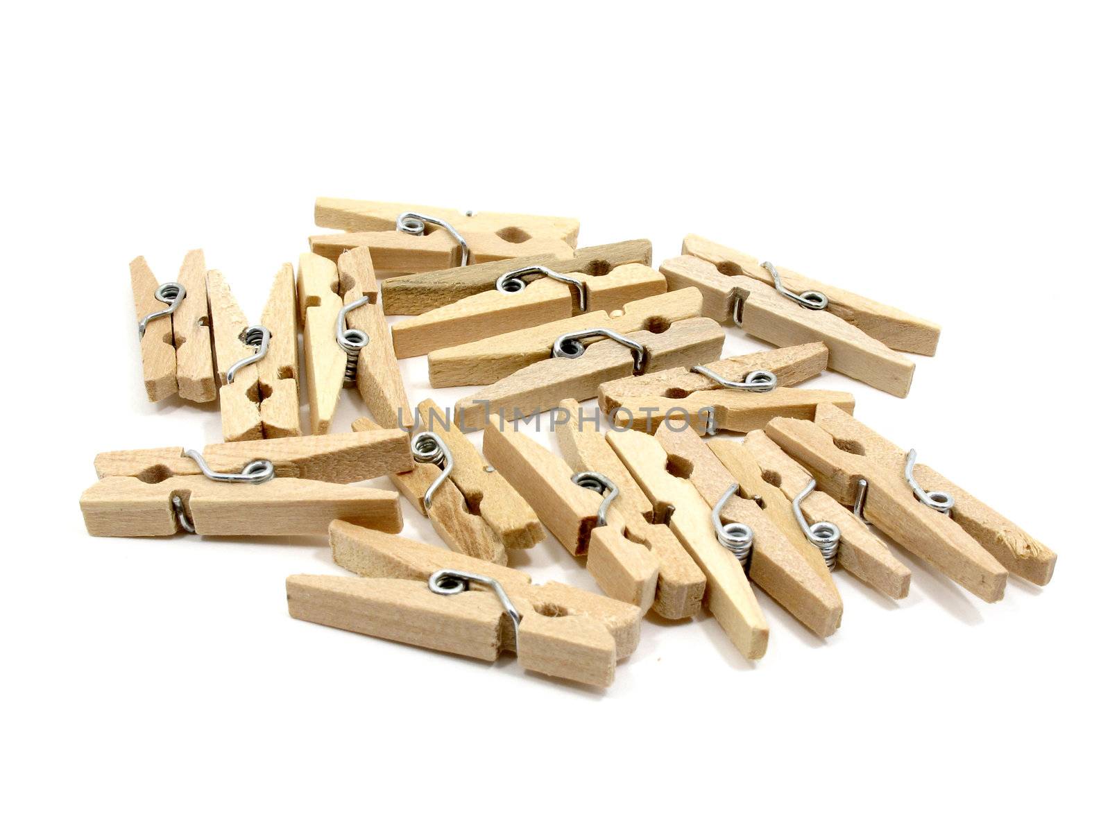 Group of many wooden pins on white background