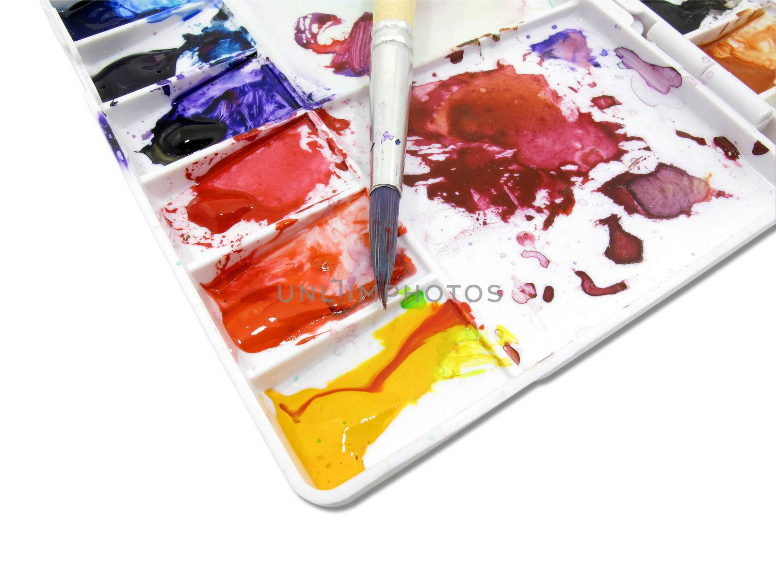 Paintbrush on art palette with blobs by iampuay