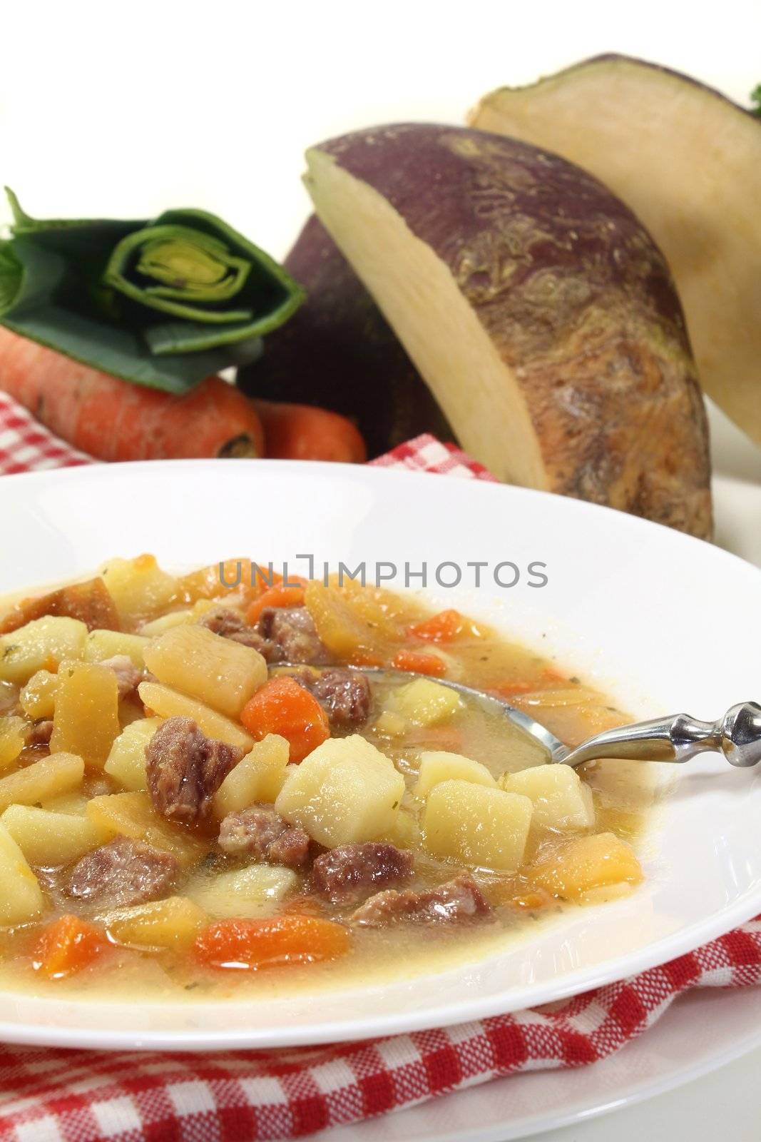 a plate of turnip stew with parsley and cook meat