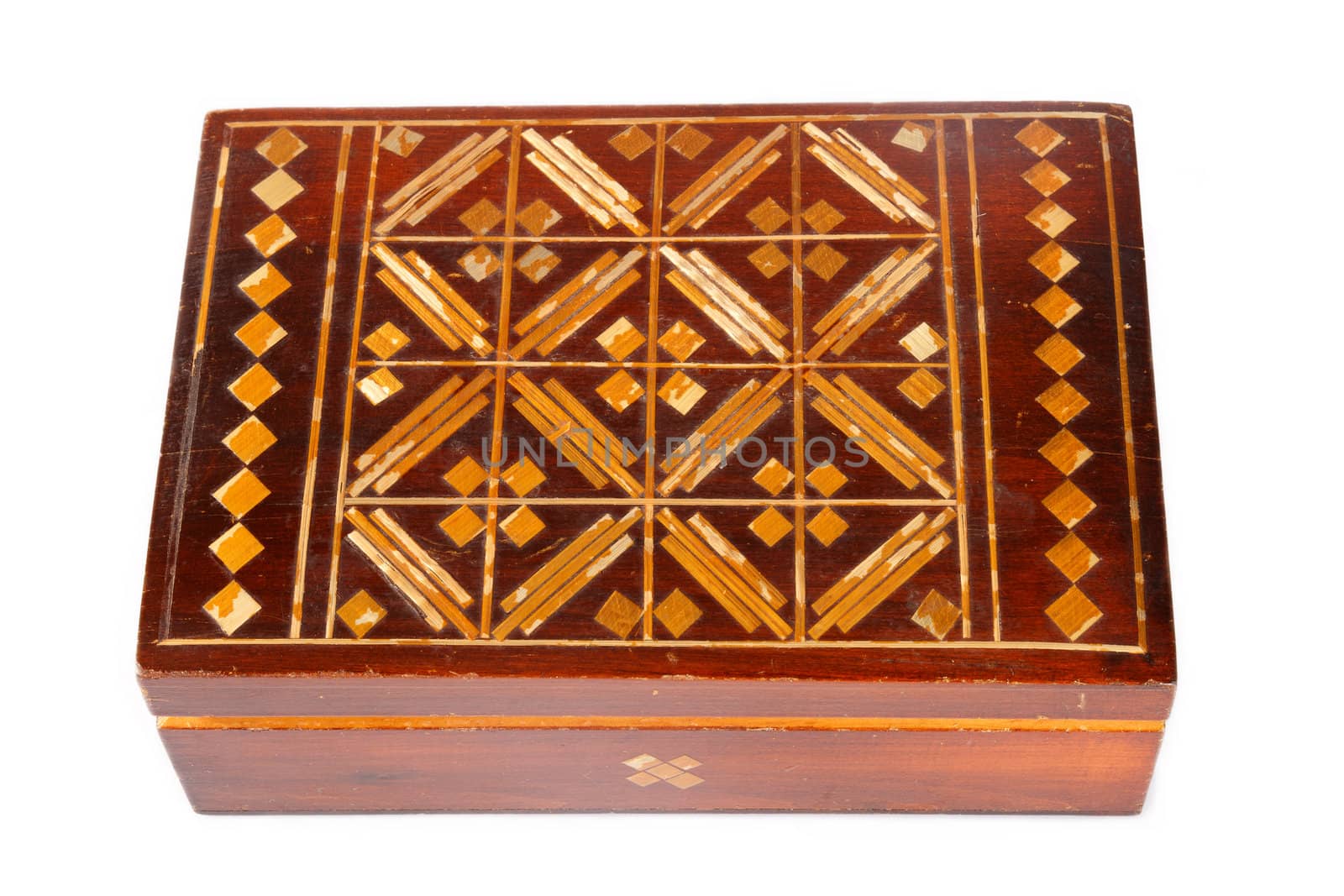an old wooden  jewelry box with ornaments on a white background