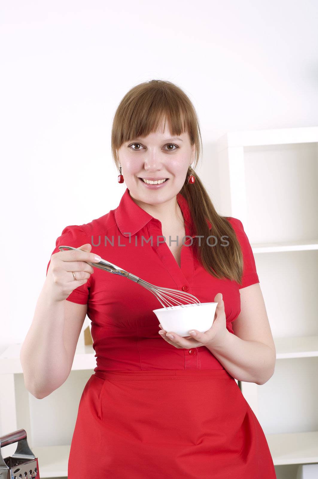 beautiful young woman cooking, the work in the kitchen