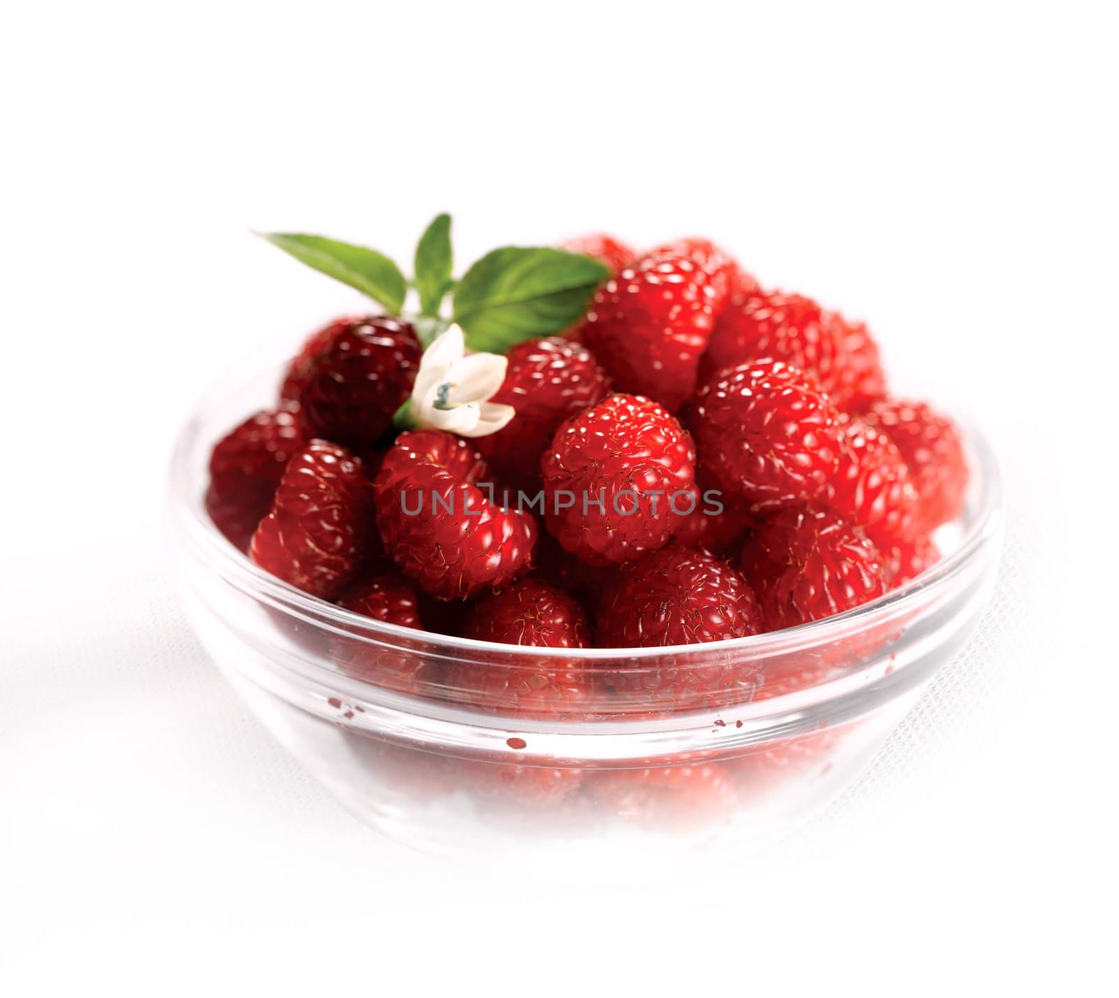 Assorted berries in bowl on natural background. Selectve focus