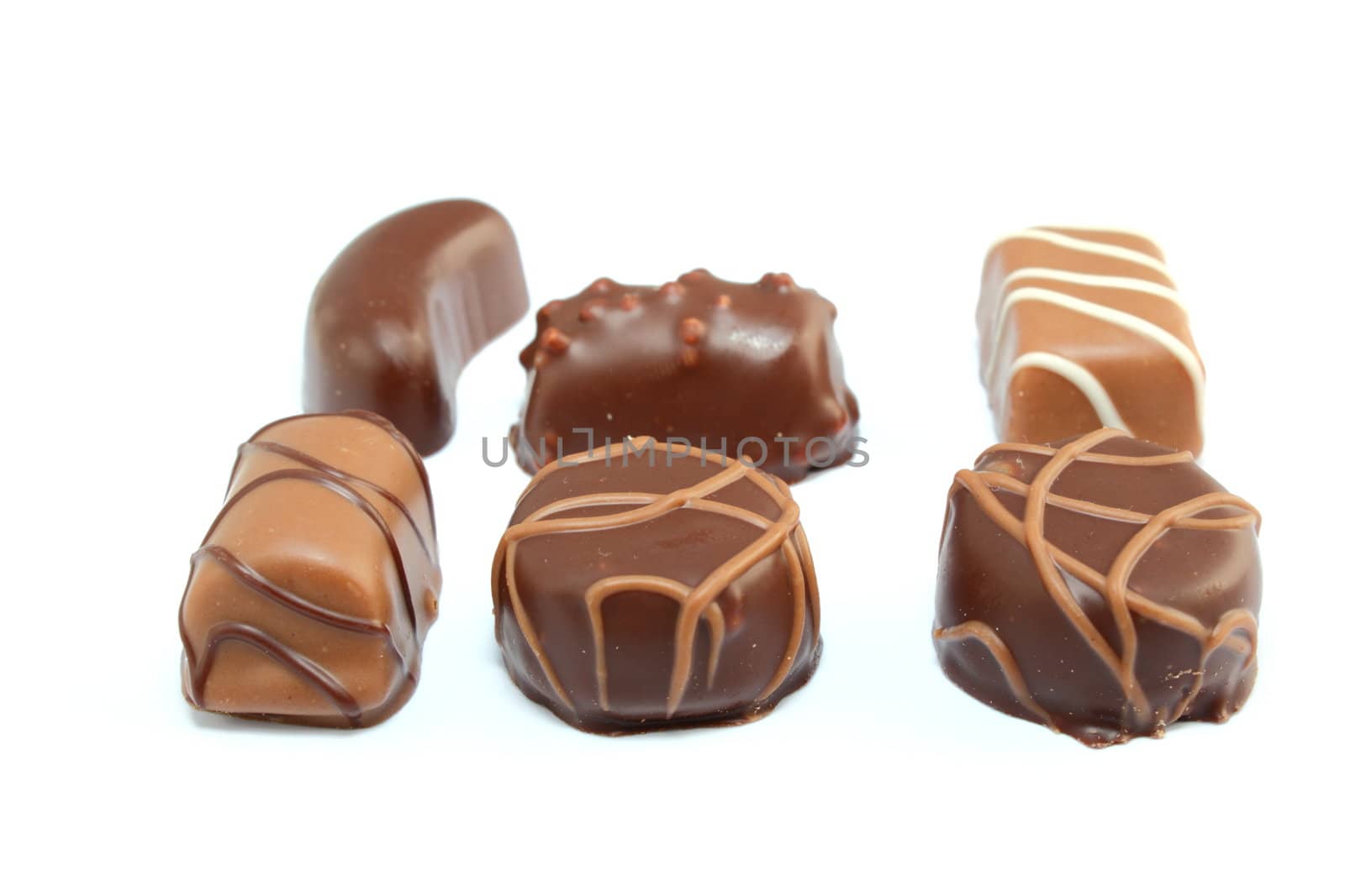 six different types of chocolate candies isolated on white