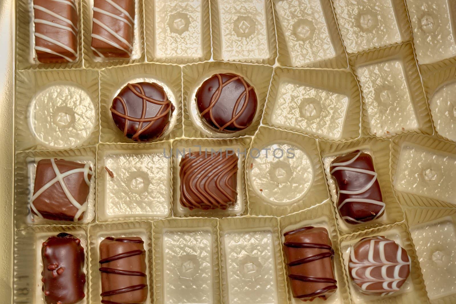 different types of chocolate candies in a candy box