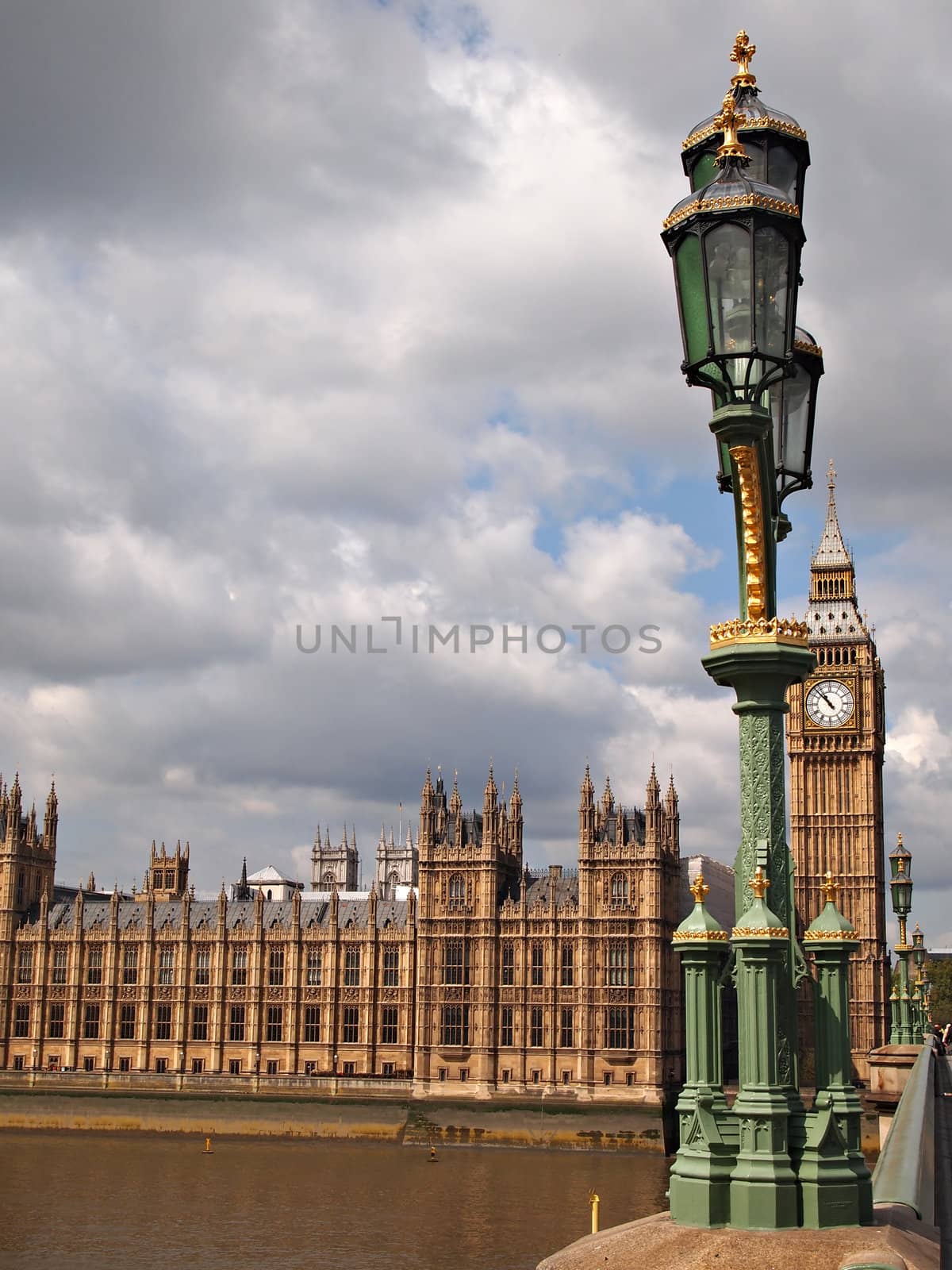 The Big Ben, the Houses of Parliament and a typical streetlight in the city of London, United Kingdom.