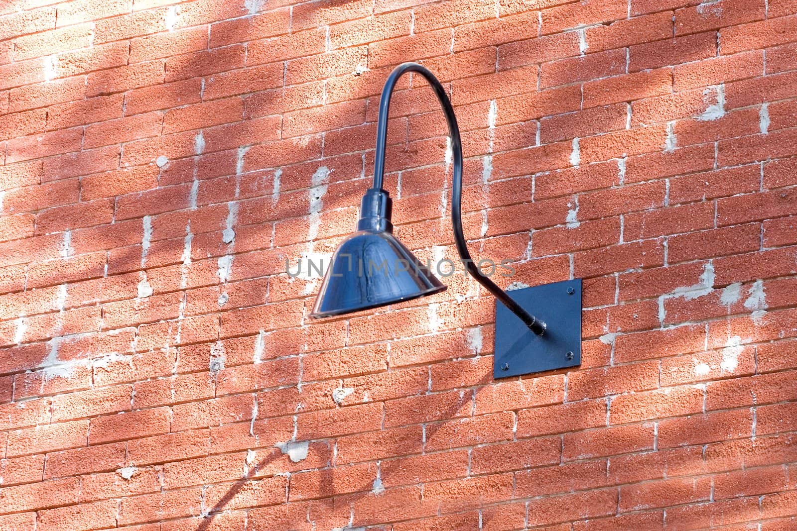 Outside light on old red brick building.