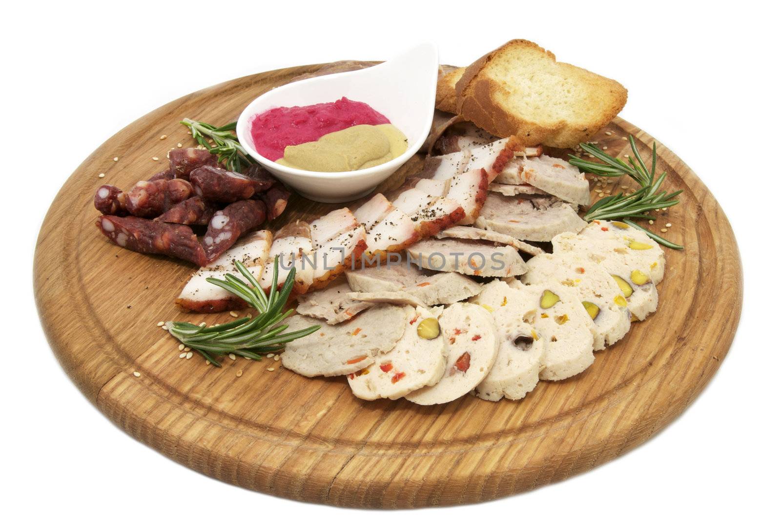 a plate with meat and sauce on a wooden plate