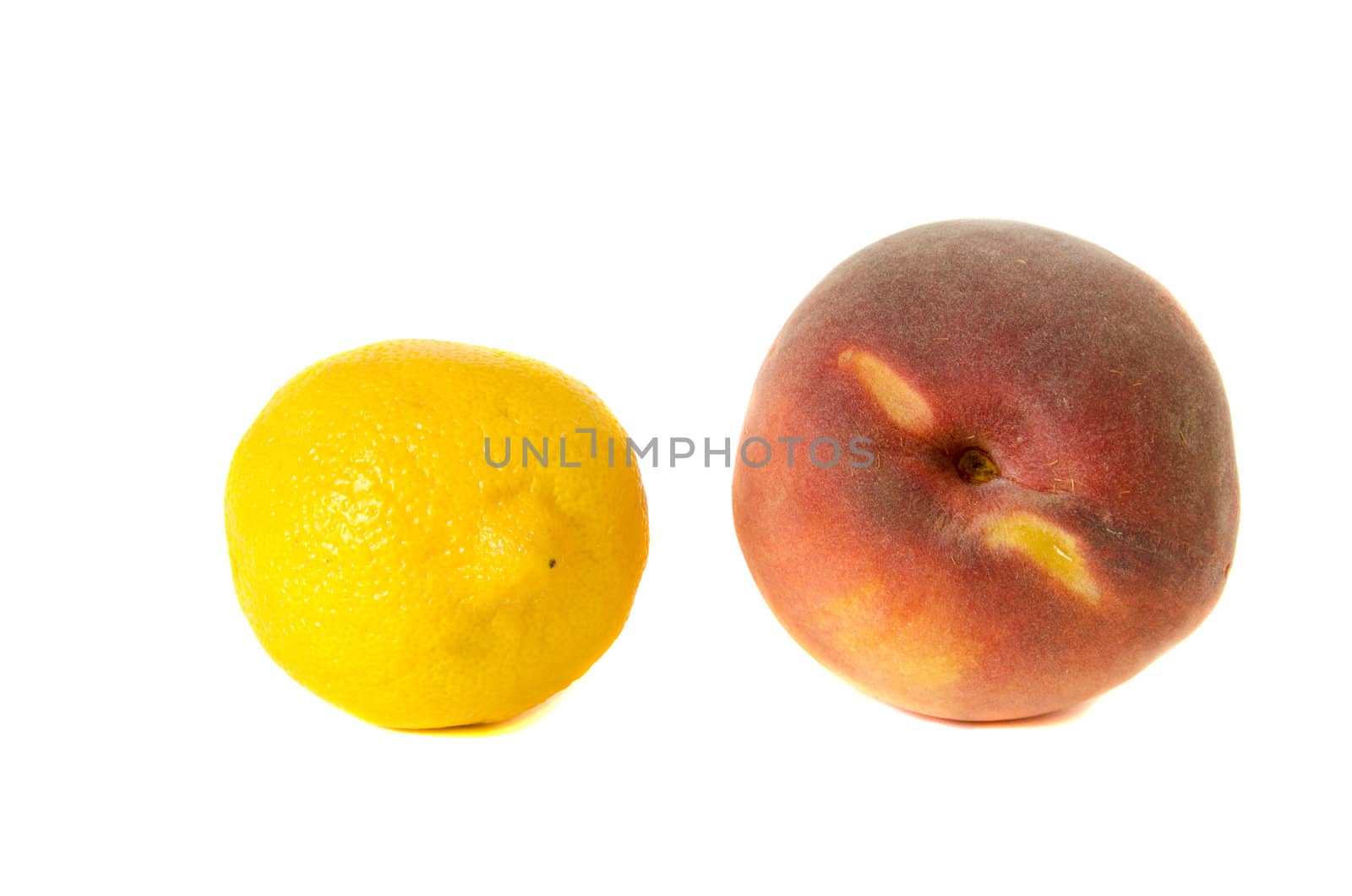 Lemon and peach isolated on white background. Healthy natural food.