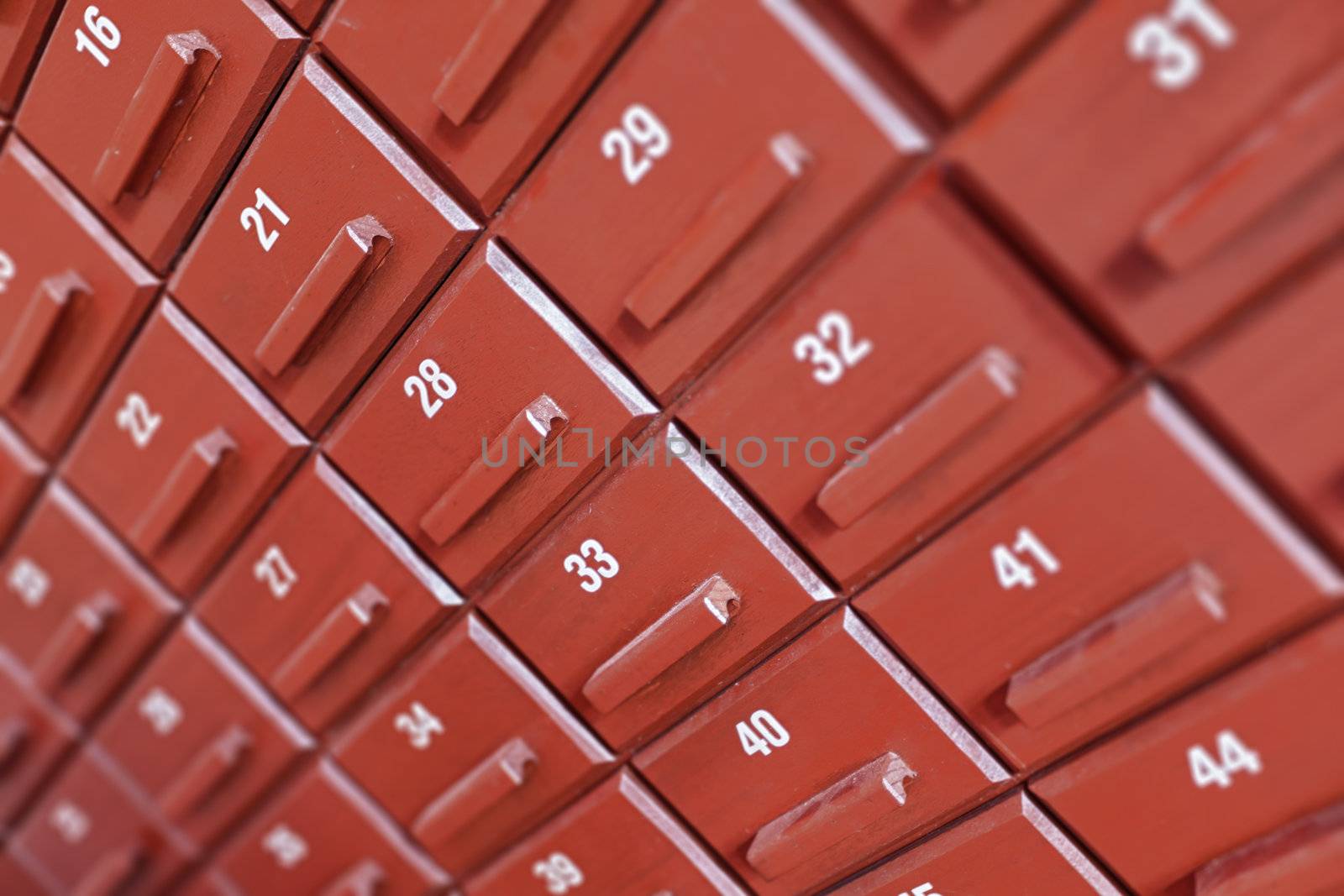 Individual numbered cells in a large wooden cabinet