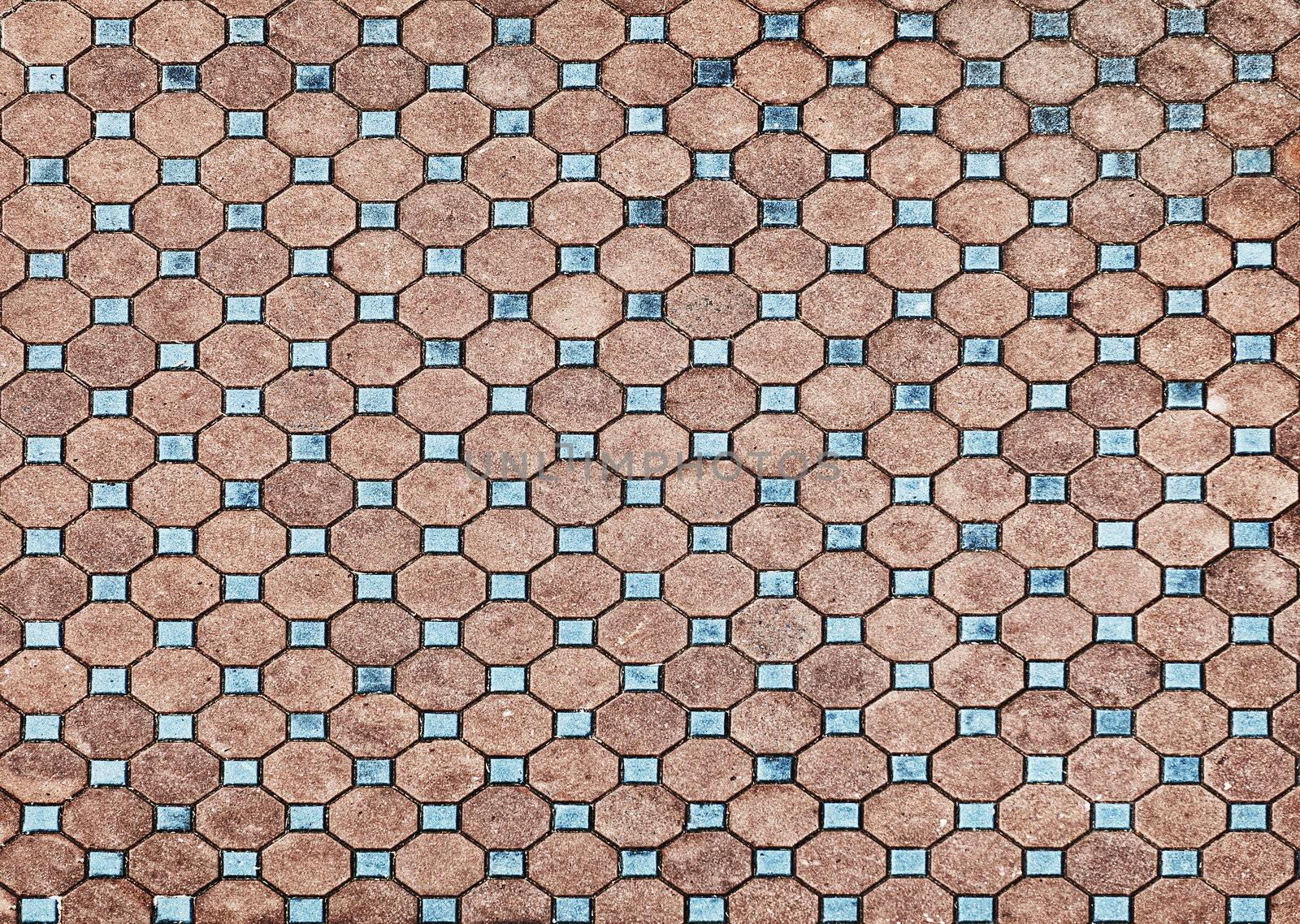 The surface of the old pavement covered with tiles