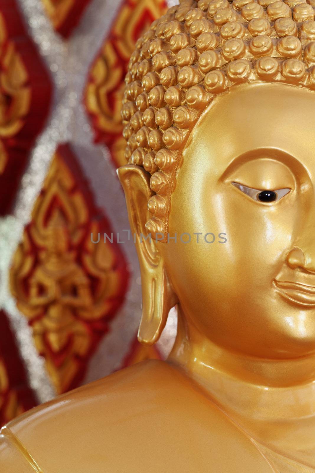 The golden image of Buddha close up