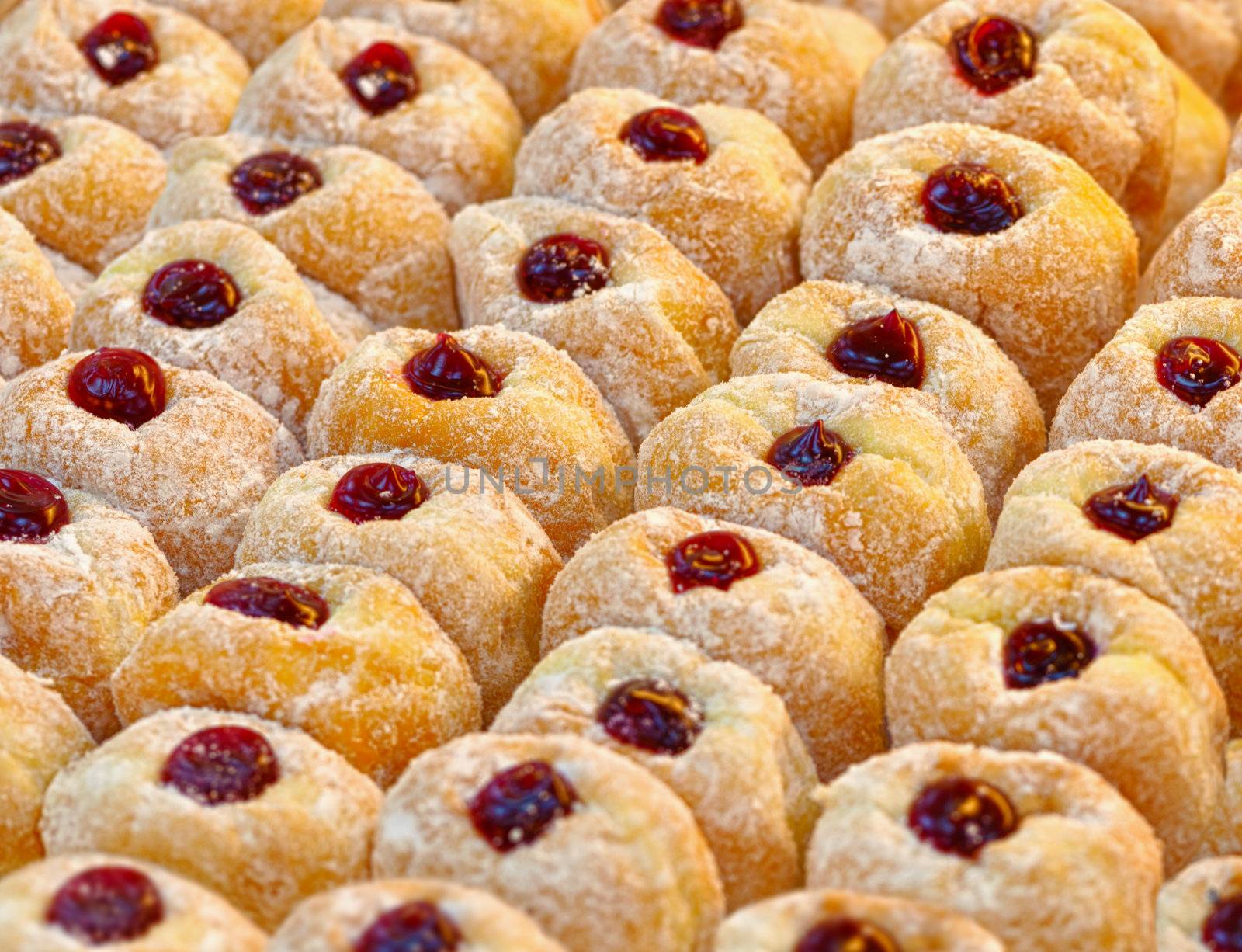 Donuts with powdered sugar on a tray by pzaxe